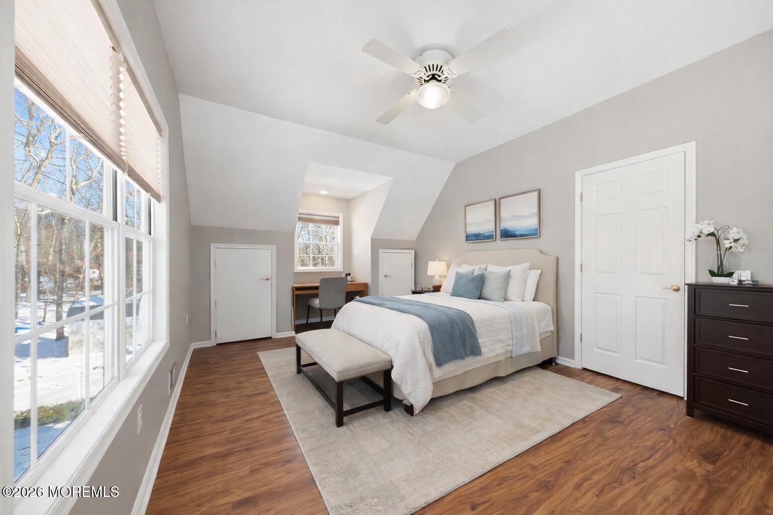 17 Amanda Lane Howell, NJ 07731 - Photo 26 of 35 a spacious bedroom with a bed and a chandelier