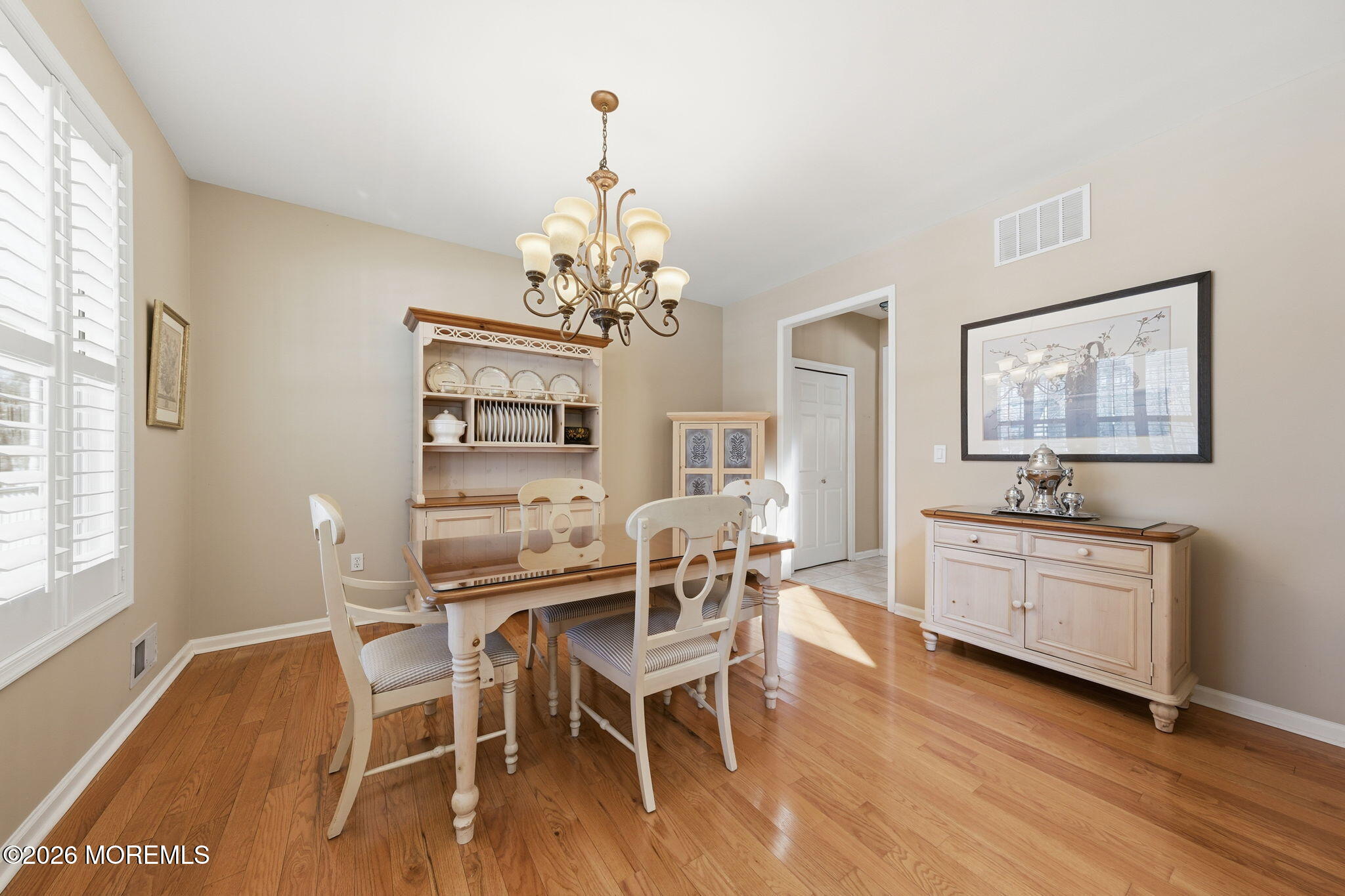 17 Amanda Lane Howell, NJ 07731 - Photo 9 of 35 a view of a dining room with furniture wooden floor and chandelier