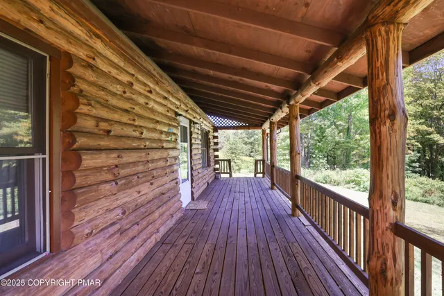 a view of a balcony with wooden floor