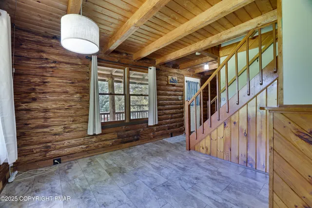 a view of an entryway with wooden floor