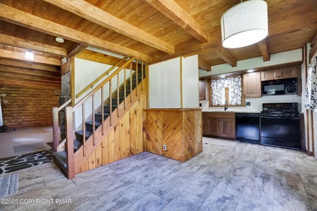 a view of kitchen and wooden floor