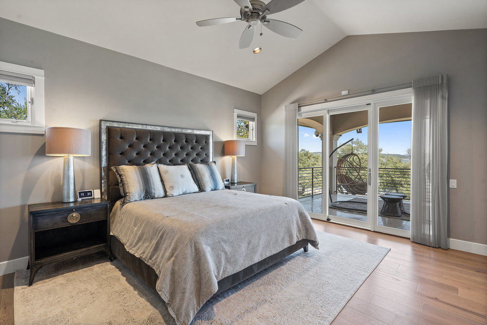 15210 Rainbow 1 Street Austin, TX 78734 - Photo 22 of 40 a bedroom with a bed and a large window