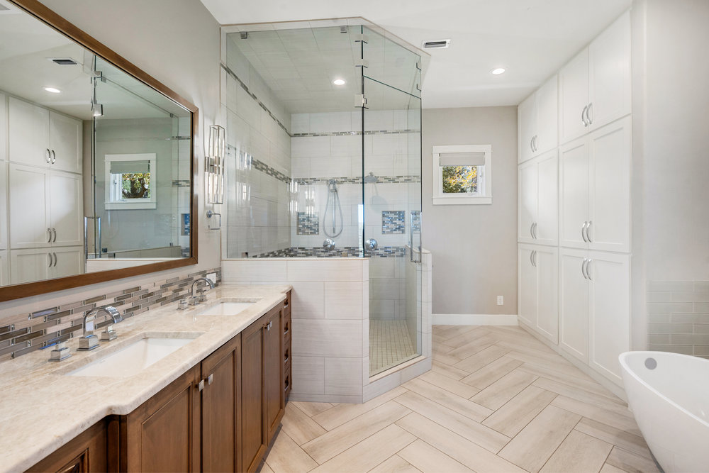 15210 Rainbow 1 Street Austin, TX 78734 - Photo 23 of 40 a bathroom with a sink and a mirror