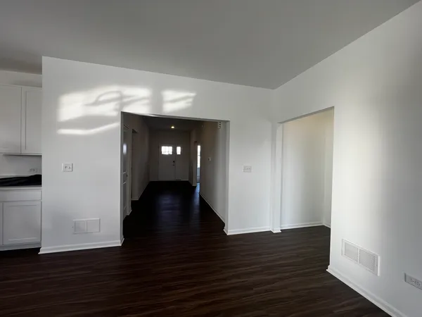 a view of gallery with wooden floor