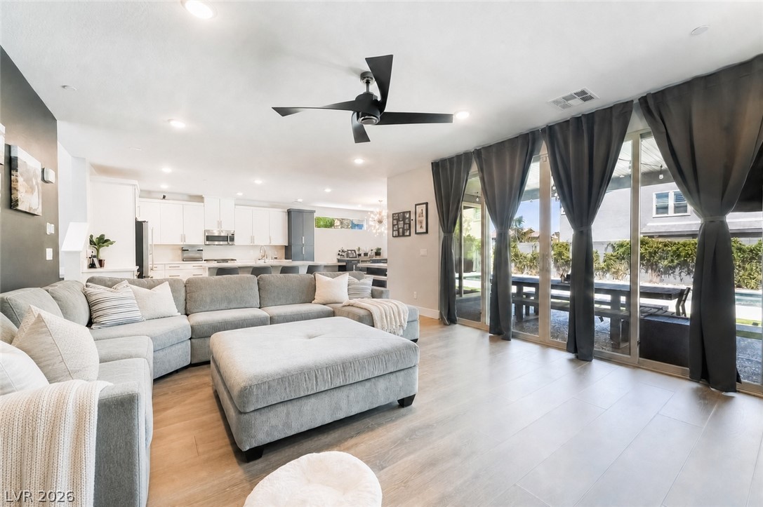 2166 Trivero Street Henderson, NV 89044 - Photo 61 of 61 An open floorplan seamlessly connects the living area to the chef's kitchen and outdoor dining.