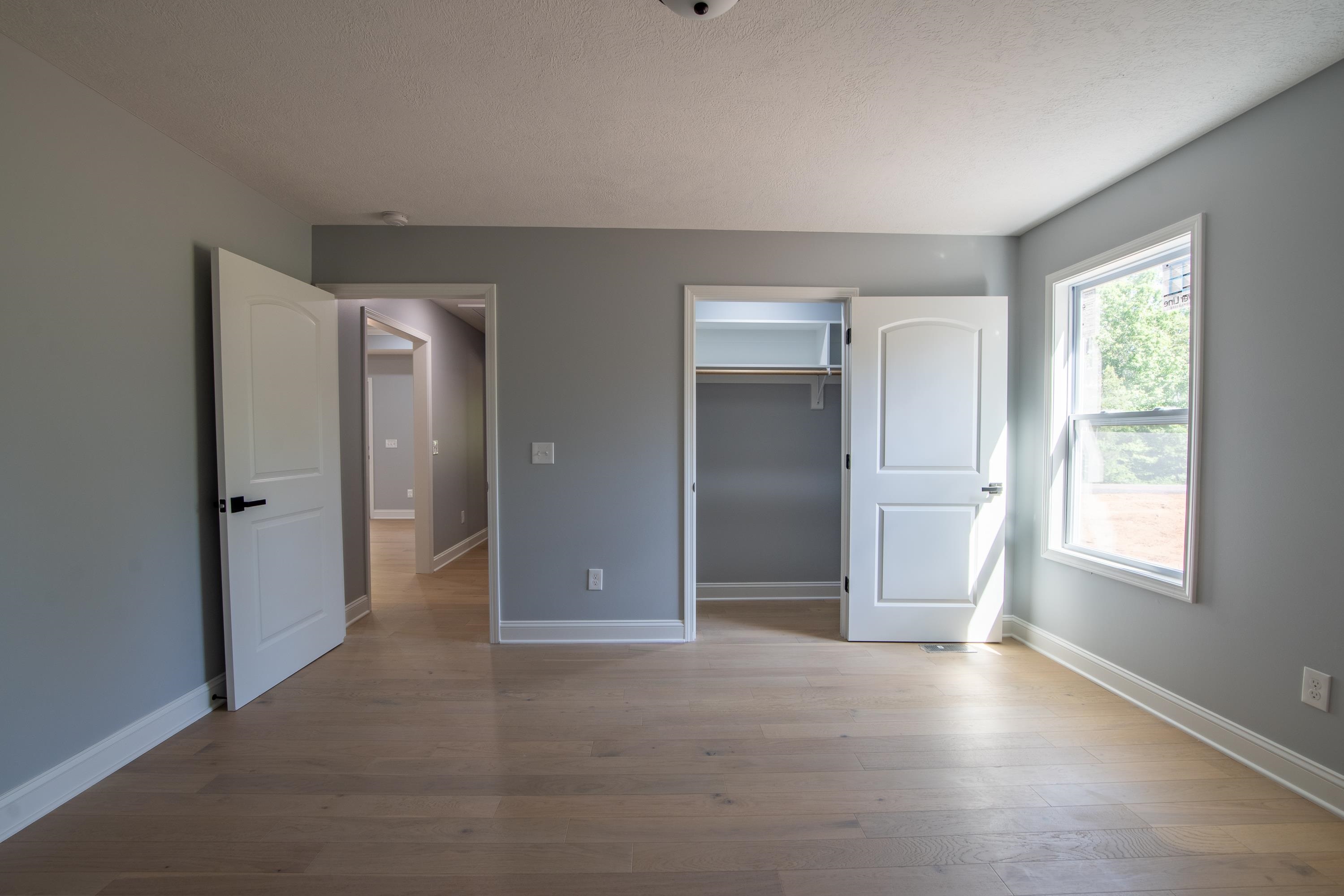 260 Range Road Savannah, TN 38372 - Photo 20 of 40 a view of empty room with window and wooden floor