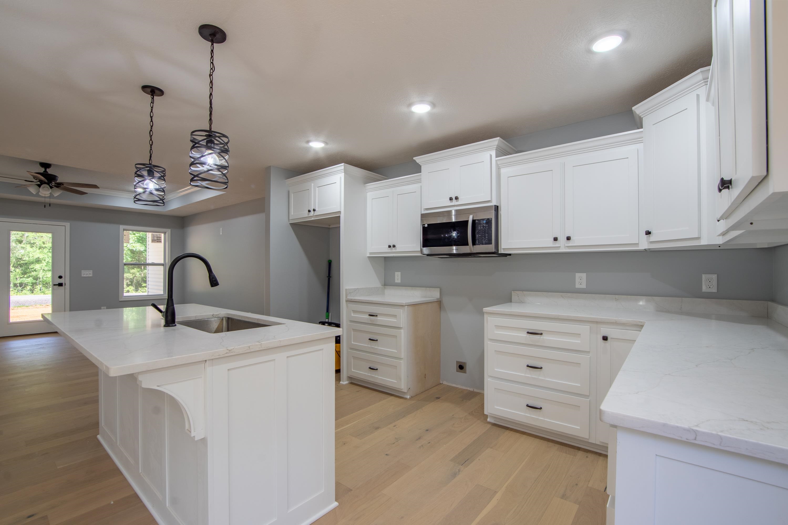 260 Range Road Savannah, TN 38372 - Photo 2 of 40 a kitchen that has cabinets