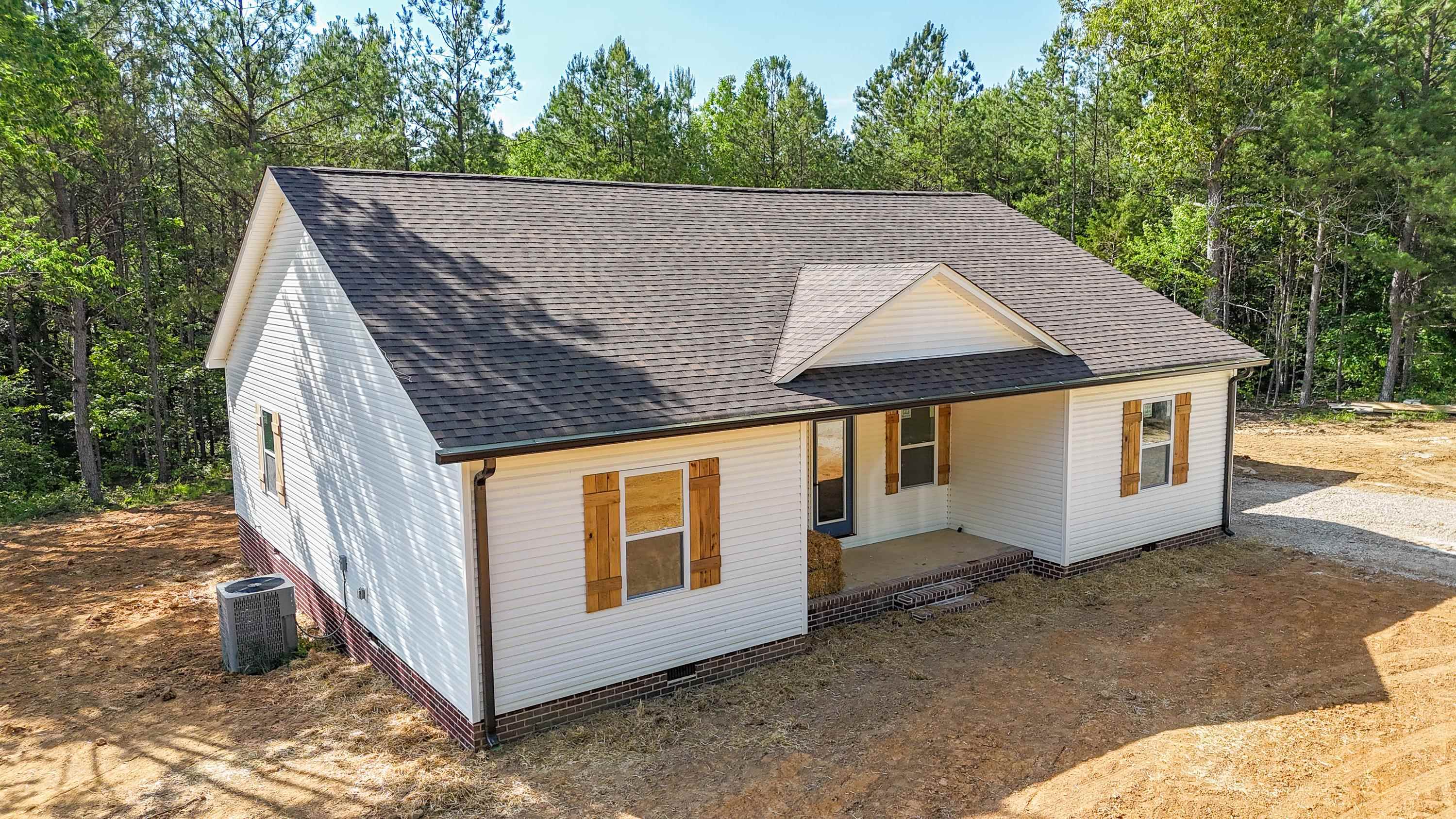 260 Range Road Savannah, TN 38372 - Photo 29 of 40 a house with trees in the background