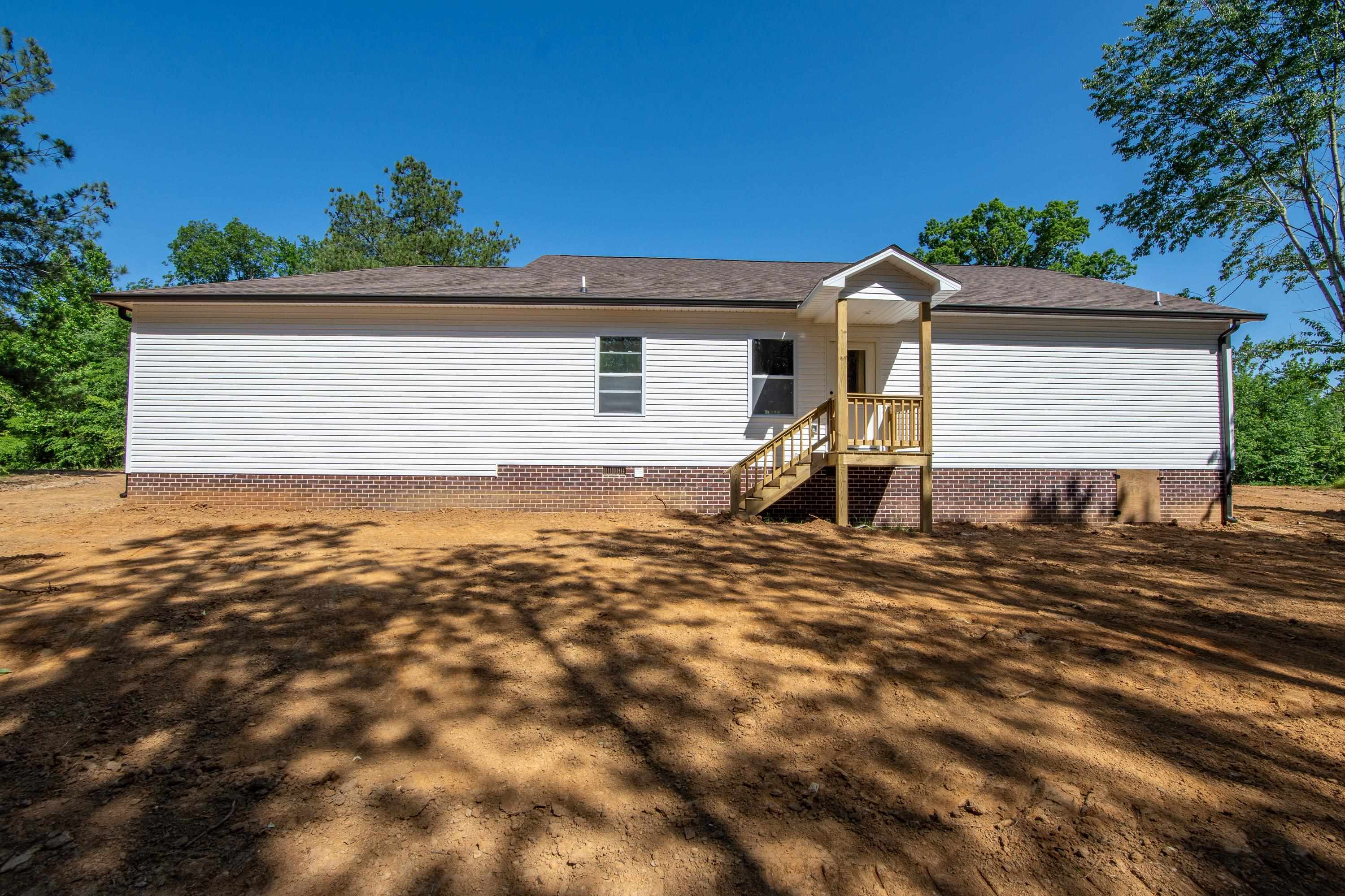 260 Range Road Savannah, TN 38372 - Photo 34 of 40 a front view of a house with a yard