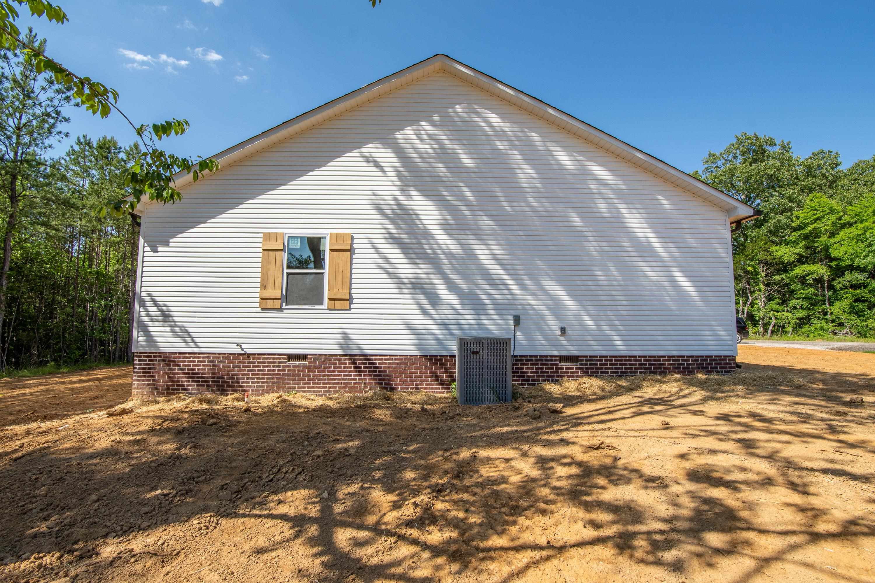 260 Range Road Savannah, TN 38372 - Photo 36 of 40 a view of a backyard of a house