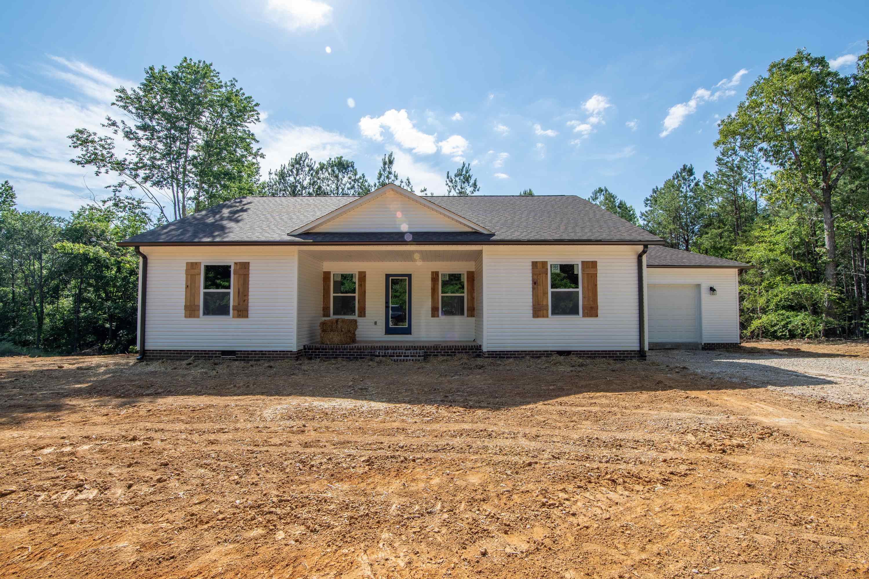 260 Range Road Savannah, TN 38372 - Photo 40 of 40 a view of a yard in front of a house with large trees