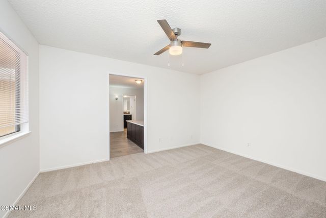 an empty room with a bathroom