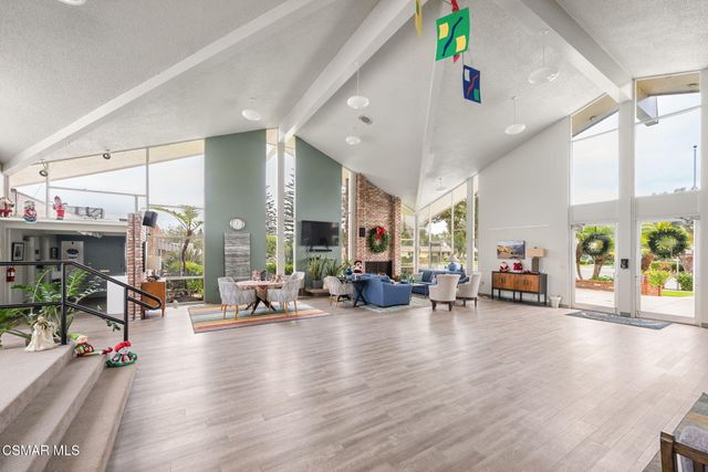 a view of a living room and dining room