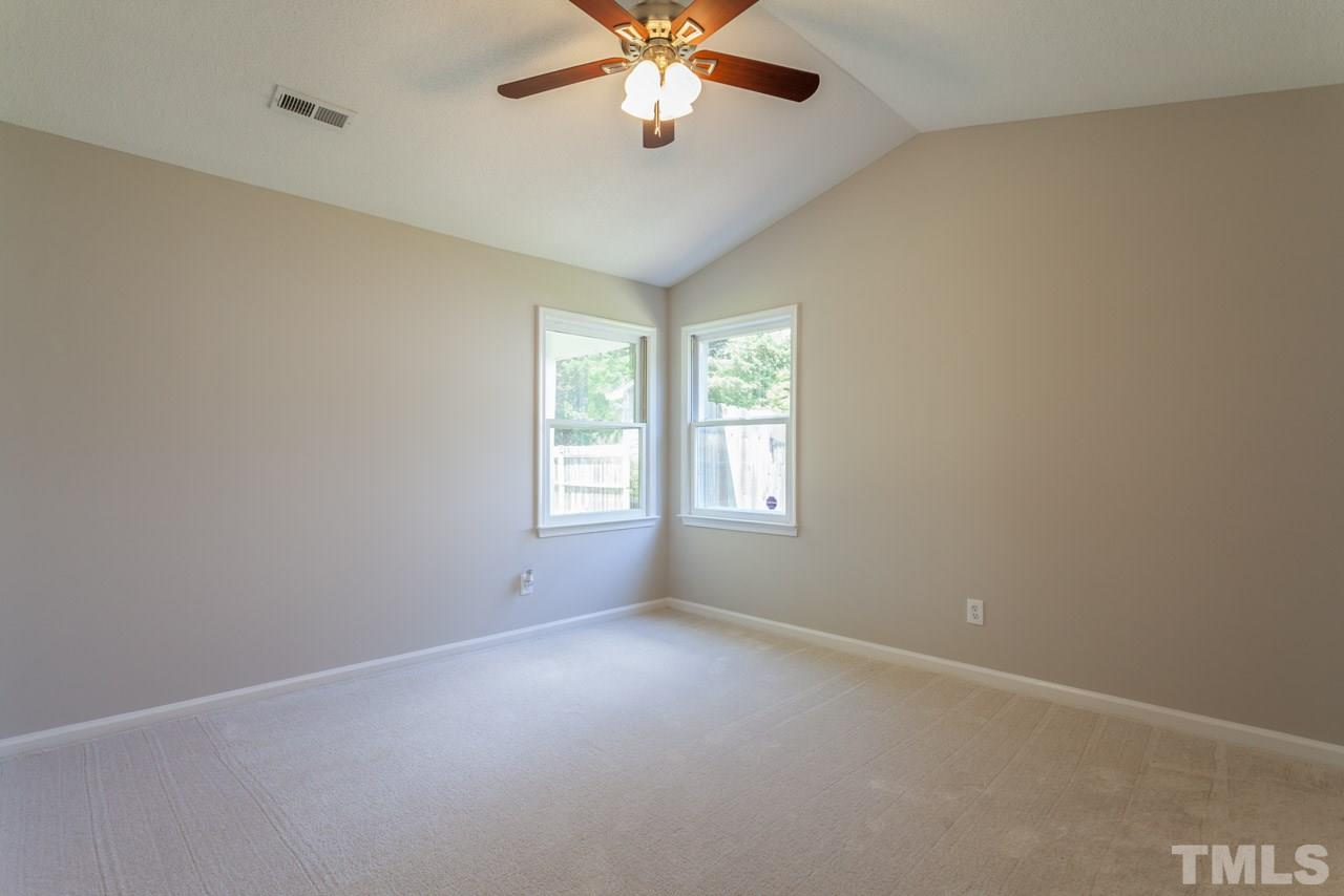 4529 Fox Road Raleigh, NC 27616 - Photo 14 of 23 an empty room with windows and ceiling fan