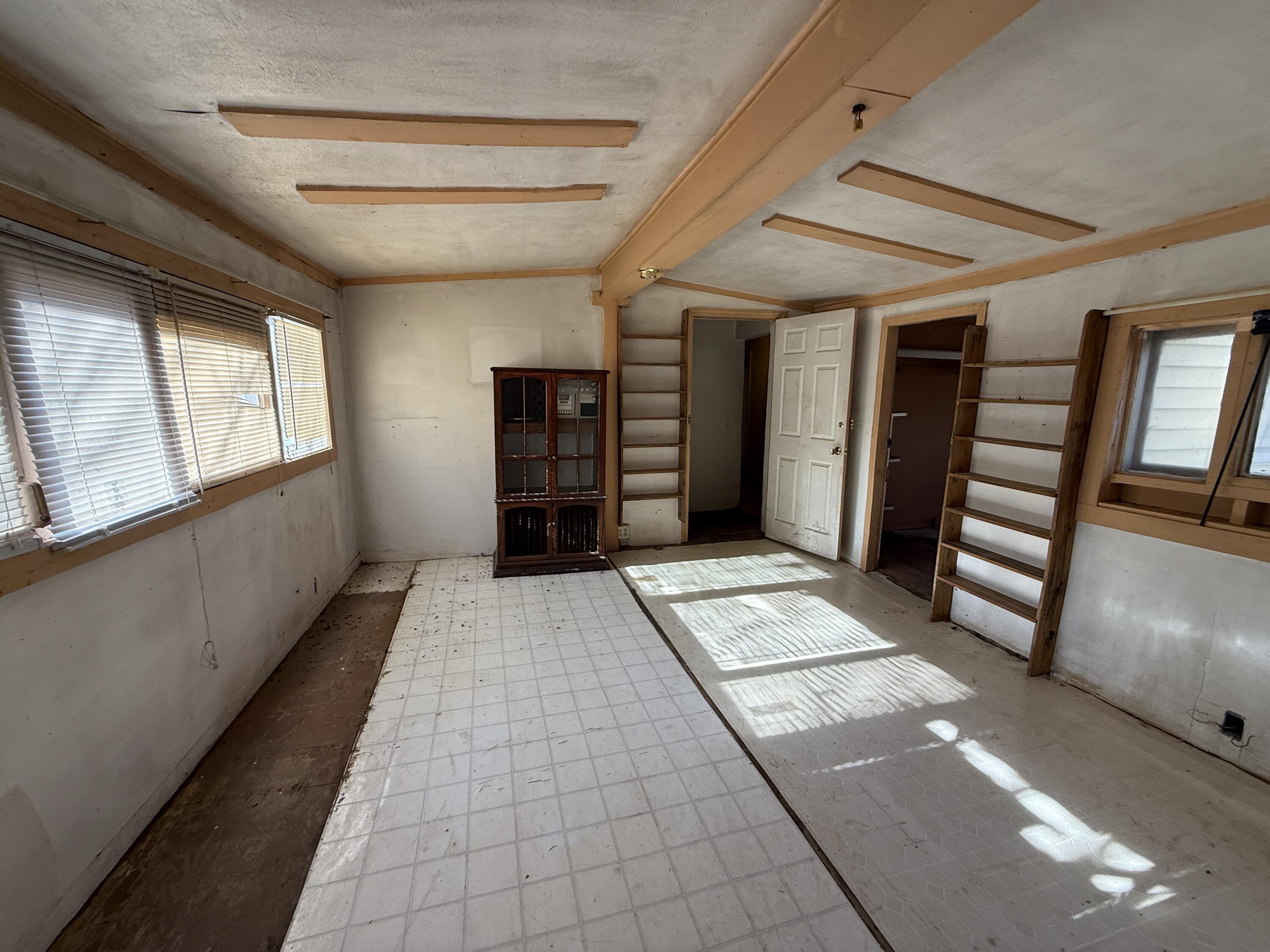 7212 Wood Haven Road Roanoke, VA 24019 - Photo 23 of 39 a view of a hallway with wooden floor and windows