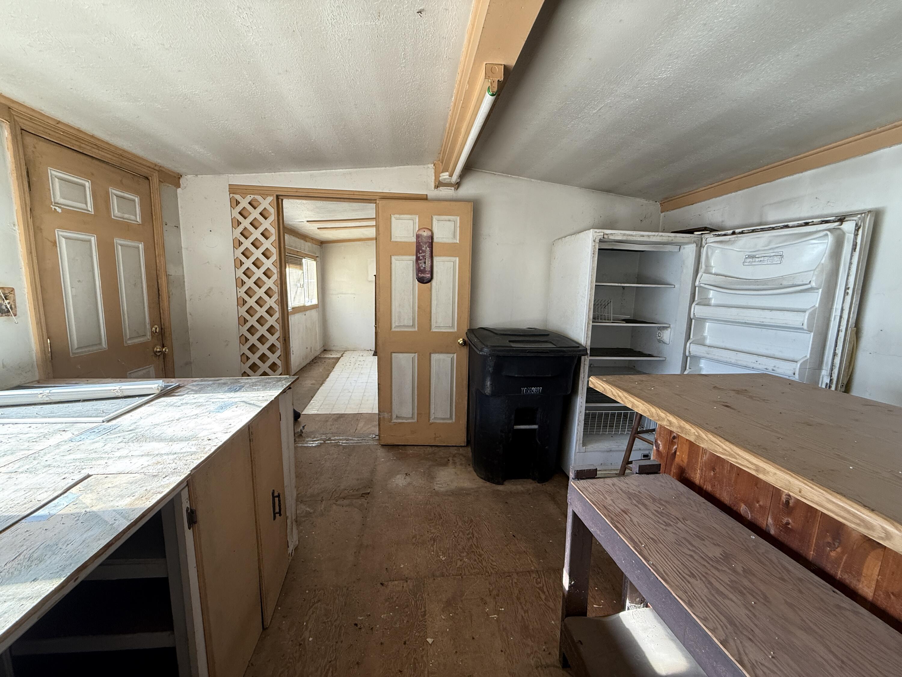 7212 Wood Haven Road Roanoke, VA 24019 - Photo 29 of 39 a kitchen with granite countertop a stove a sink and a refrigerator
