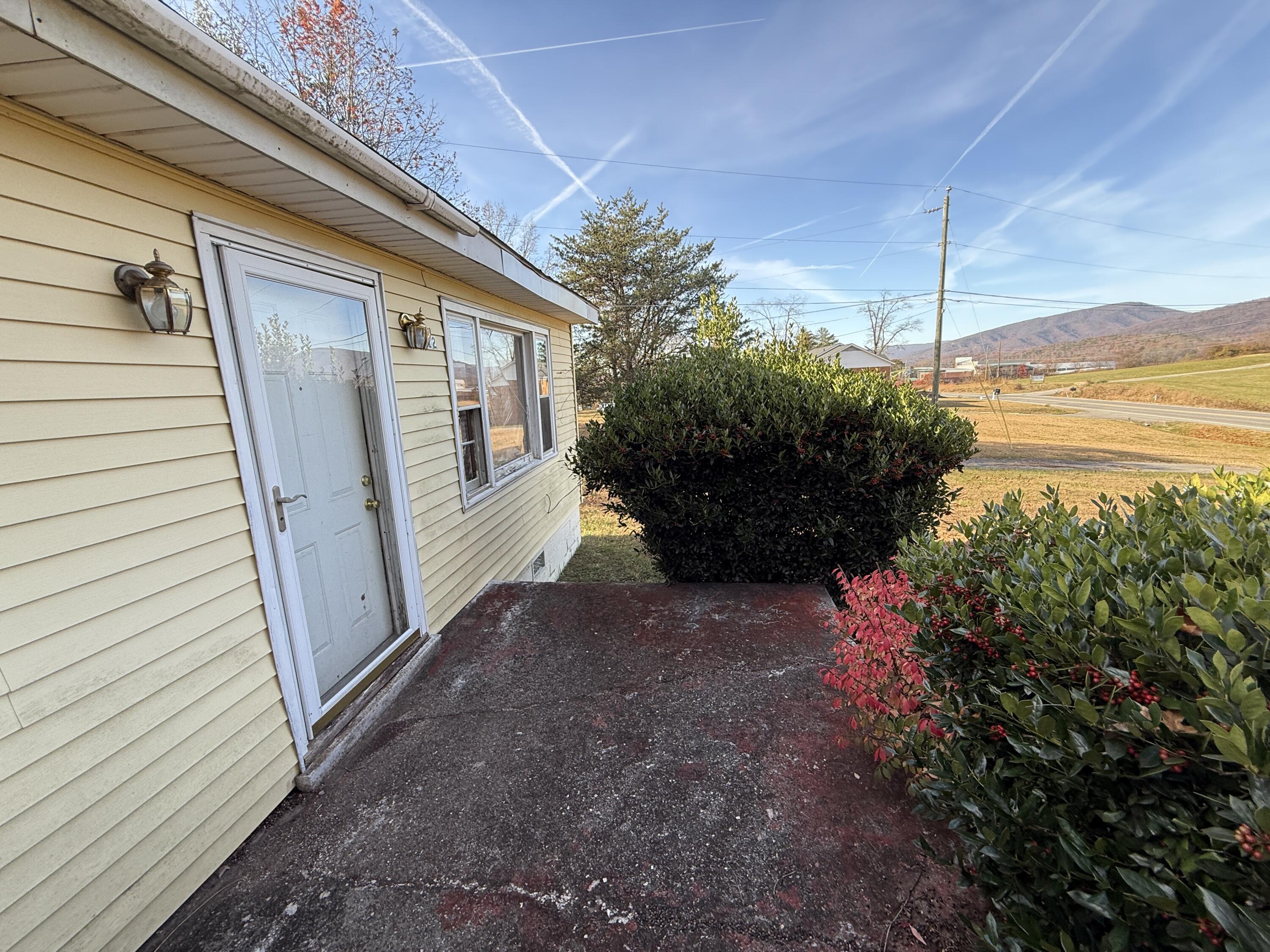 7212 Wood Haven Road Roanoke, VA 24019 - Photo 5 of 39 a view of a house with backyard and sitting area