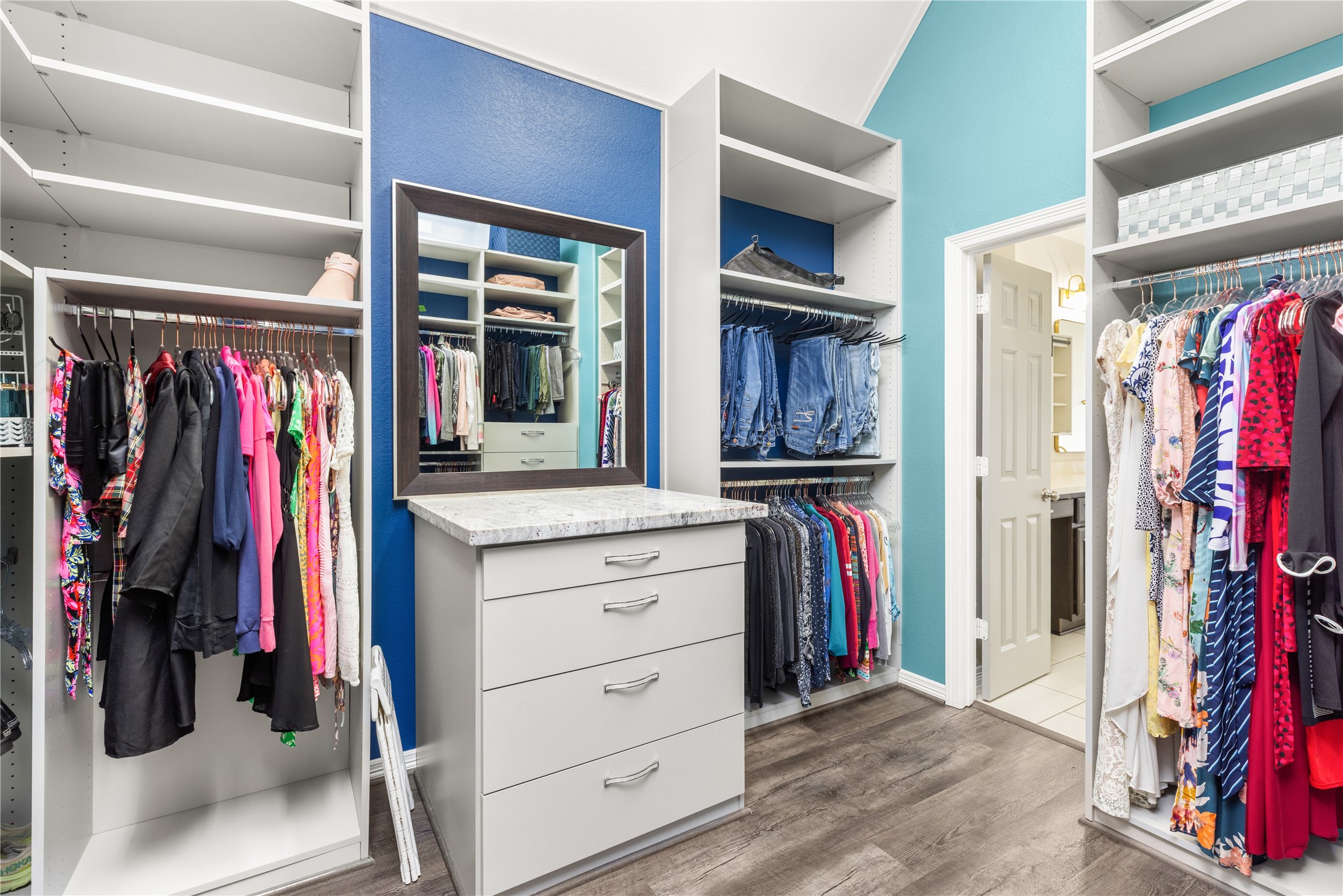 10215 Spring Shadows Park Circle Houston, TX 77080 - Photo 29 of 44 Custom shelving throughout large primary closet