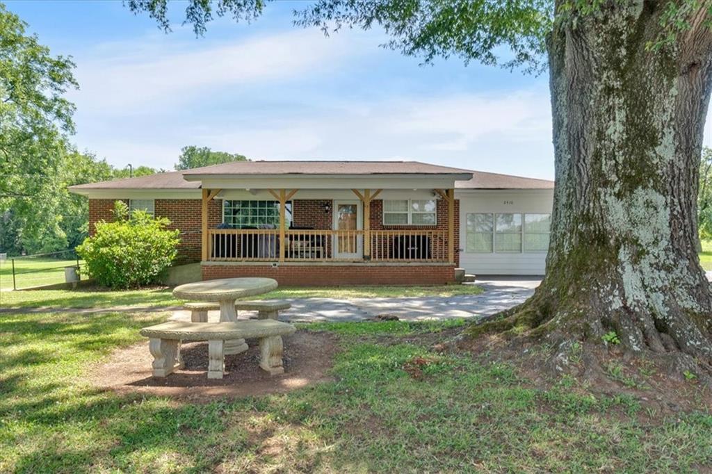 2454 Hall Station Road Northwest Adairsville, GA 30103 - Photo 11 of 35 a view of a house with a yard