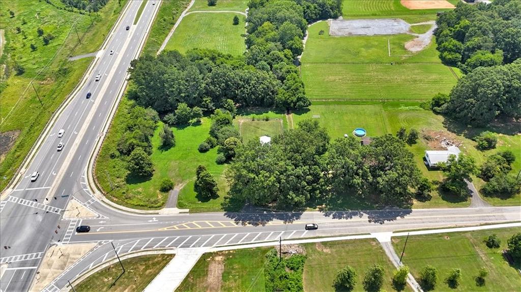 2454 Hall Station Road Northwest Adairsville, GA 30103 - Photo 9 of 35 a view of a swimming pool with a yard and plants