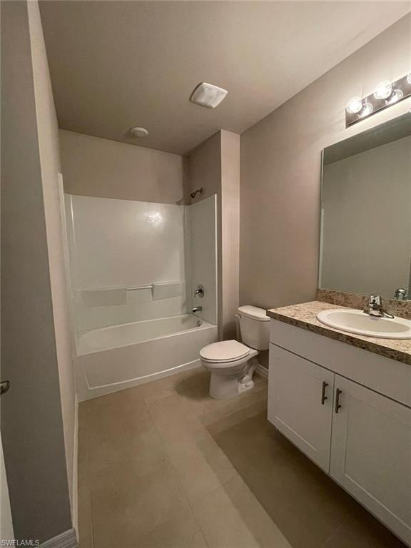 2802 40th Street Southwest Lehigh Acres, FL 33976 - Photo 11 of 14 Full bathroom with vanity, shower / bathtub combination, and tile patterned flooring
