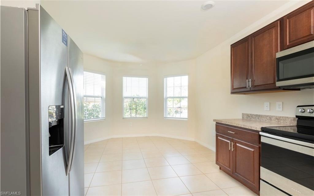 2802 40th Street Southwest Lehigh Acres, FL 33976 - Photo 2 of 14 Kitchen with appliances with stainless steel finishes and light countertops