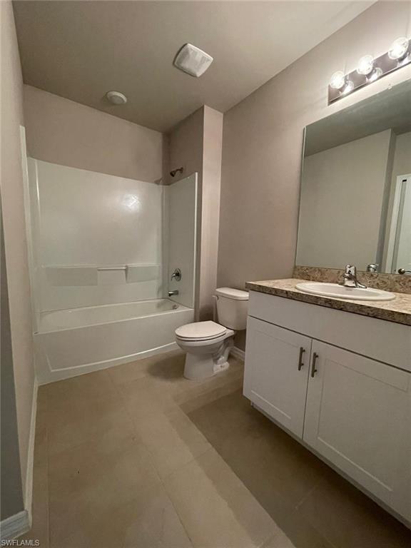 2802 40th Street Southwest Lehigh Acres, FL 33976 - Photo 9 of 14 Bathroom with vanity and tub / shower combination