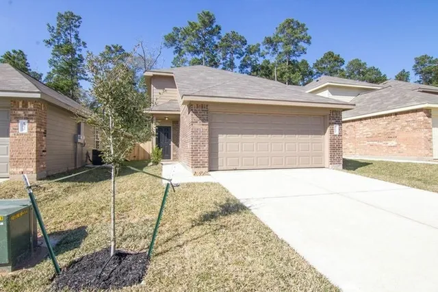 a view of house with yard