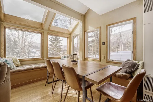 a dining room with furniture and window