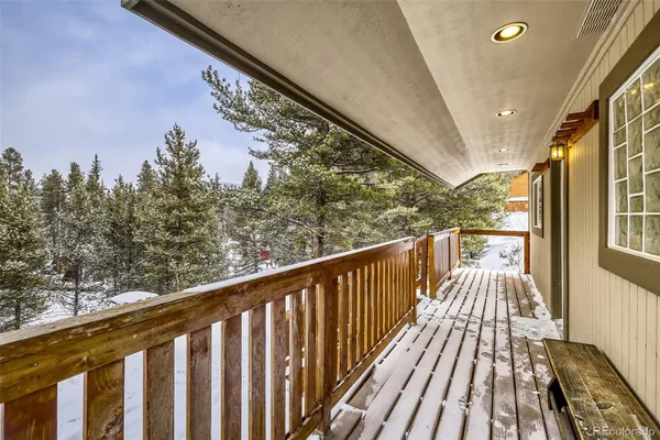 a view of balcony with wooden floor