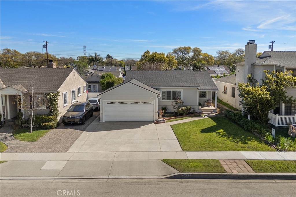 3426 Roxanne Avenue Long Beach, CA 90808 - Photo 19 of 21 a view of house and yard with green space