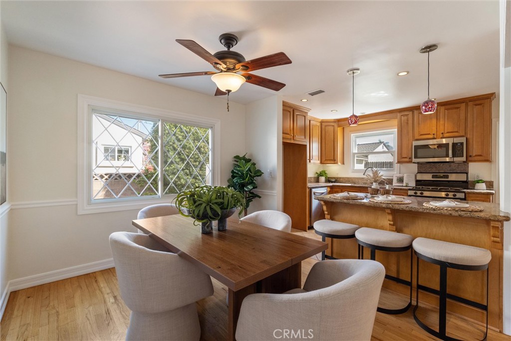 3426 Roxanne Avenue Long Beach, CA 90808 - Photo 5 of 21 a dining room with furniture window and wooden floor
