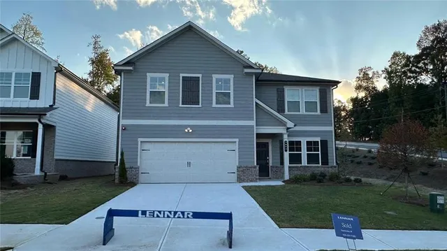 a view of a yard in front view of a house