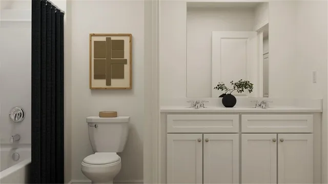 a bathroom with a sink and mirror with toilet