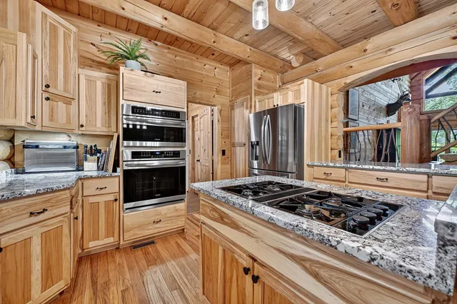 a bedroom with a large bed and a large window