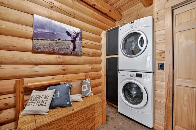 a bathroom with double vanity sink and a mirror