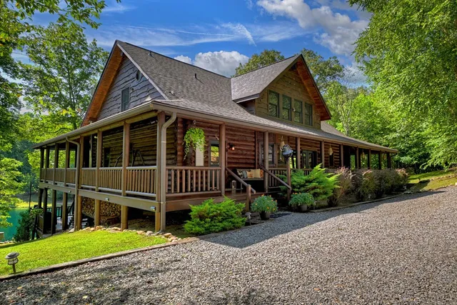 a living room with furniture a fireplace and a window