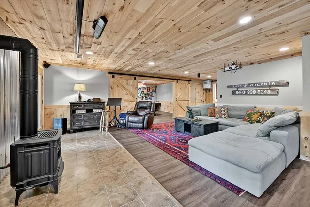 a kitchen with stainless steel appliances granite countertop a stove microwave and sink