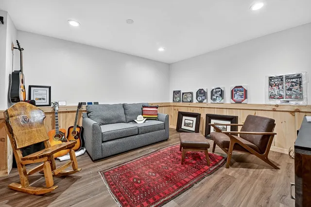 a view of a swimming pool with a yard and plants