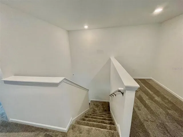 an empty room with a hallway