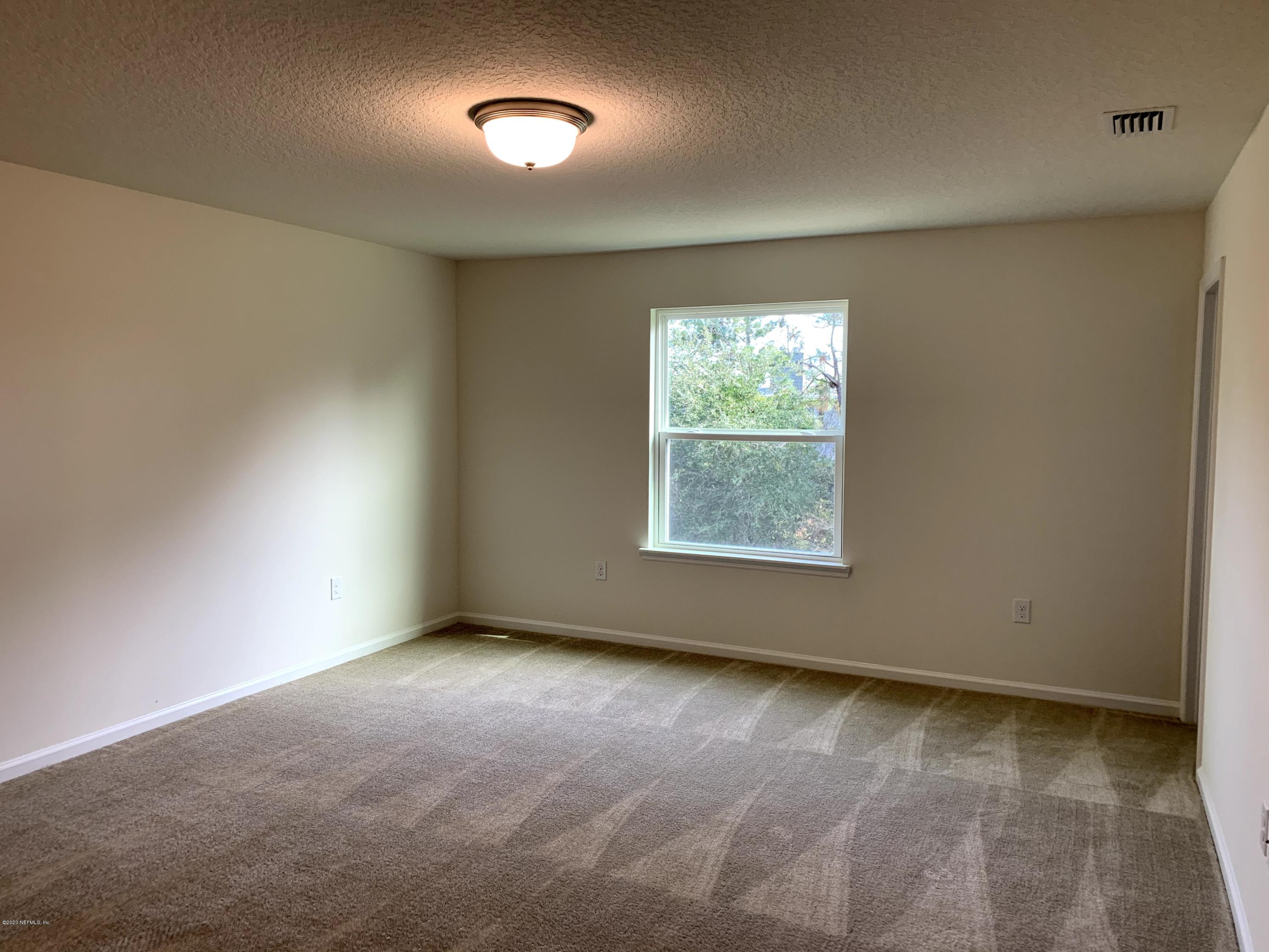 57 Bella Vita Way Ormond Beach, FL 32174 - Photo 8 of 16 an empty room with a window