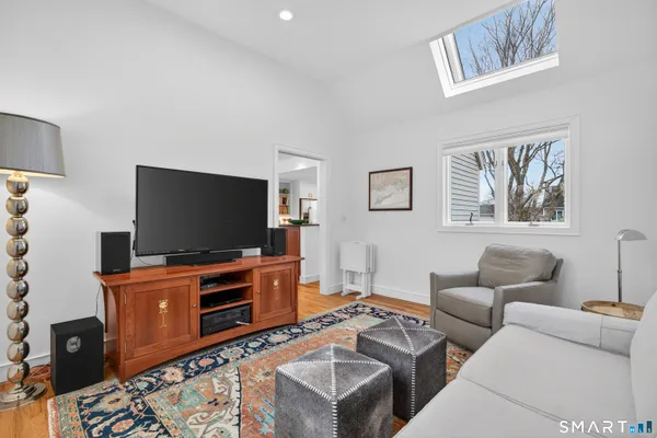 a spacious bedroom with a bed a table and a couch