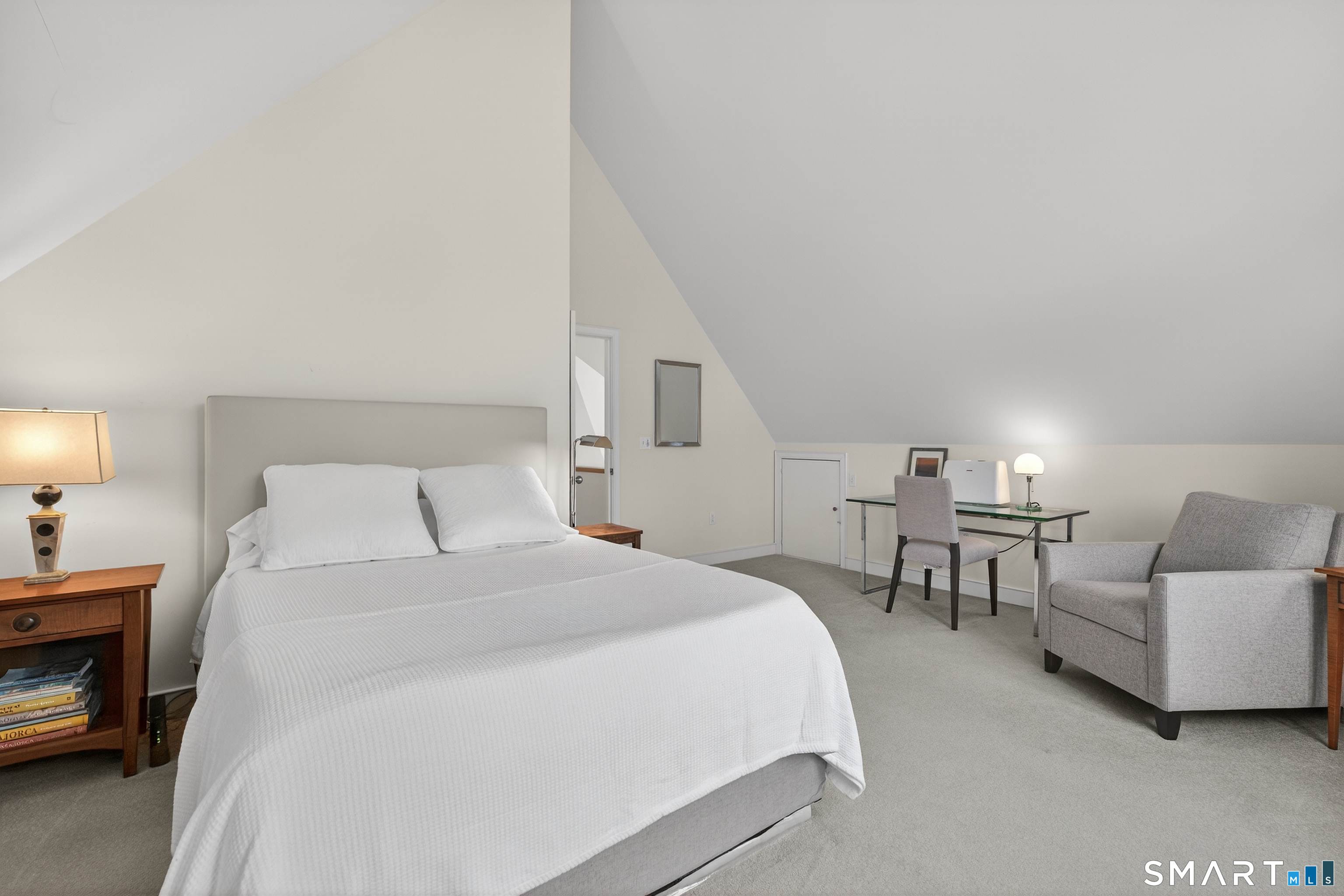 83 Old North Road Mystic, CT 06355 - Photo 23 of 40 a spacious bedroom with a bed a couch and a night stand