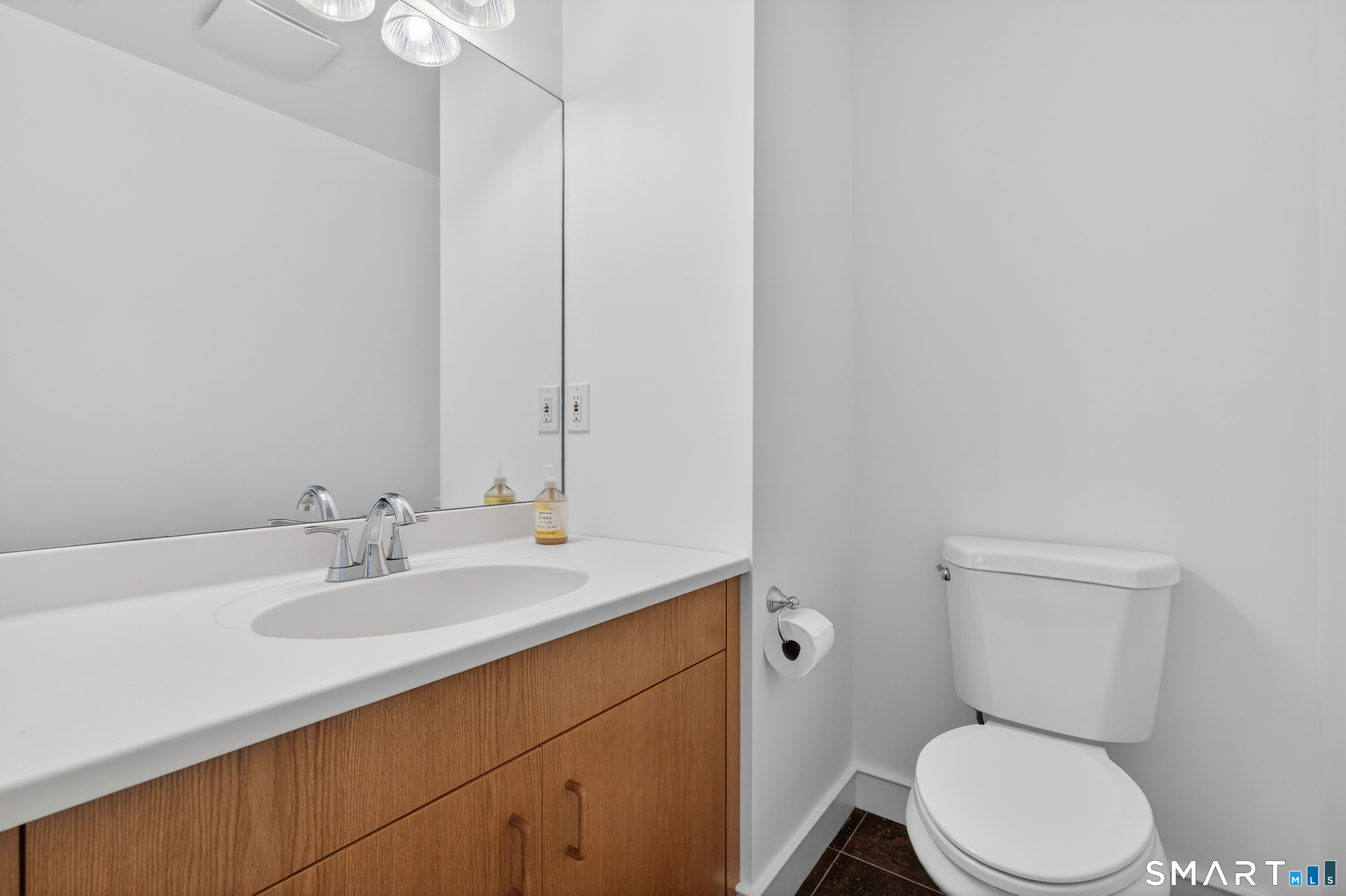 83 Old North Road Mystic, CT 06355 - Photo 24 of 40 a bathroom with a sink a toilet and a mirror