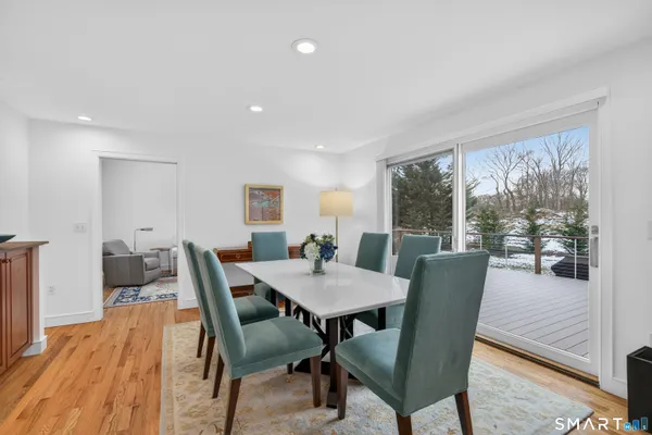 a view of a dining room with furniture window and wooden floor
