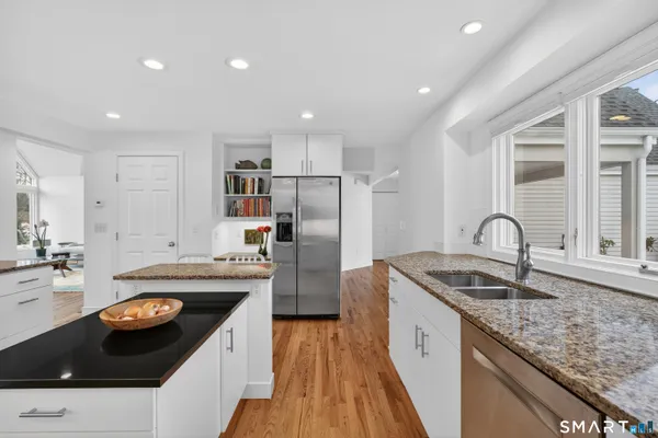 a kitchen with a sink stove and refrigerator