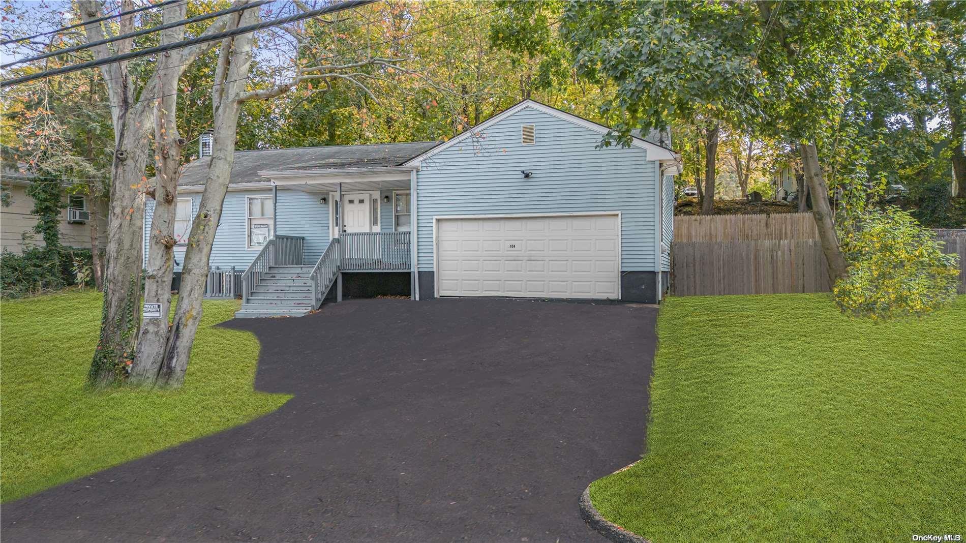 104 Lower Rocky Point Road Sound Beach, NY 11789 - Photo 1 of 1 a front view of a house with a yard and garage