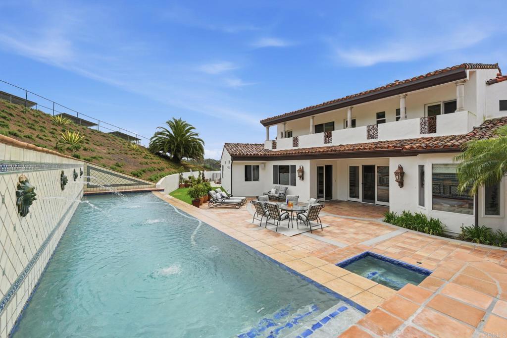 3244 Olivenhain Farms Road Encinitas, CA 92024 - Photo 43 of 47 a view of a house with patio and a garden