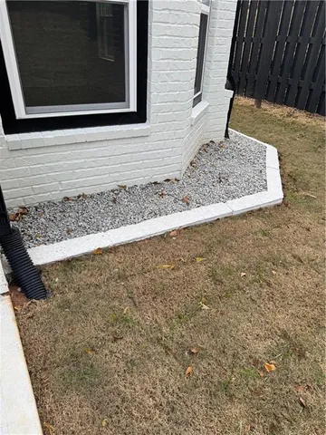 a kitchen with stainless steel appliances white cabinets and a stove top oven