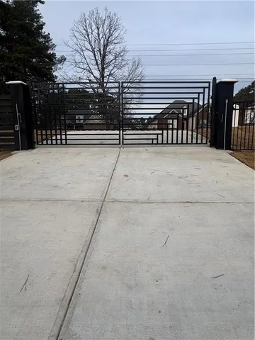 a kitchen with granite countertop white cabinets and sink